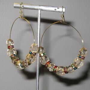 Goldtone hoop earrings with pale yellow faceted acrylic beads